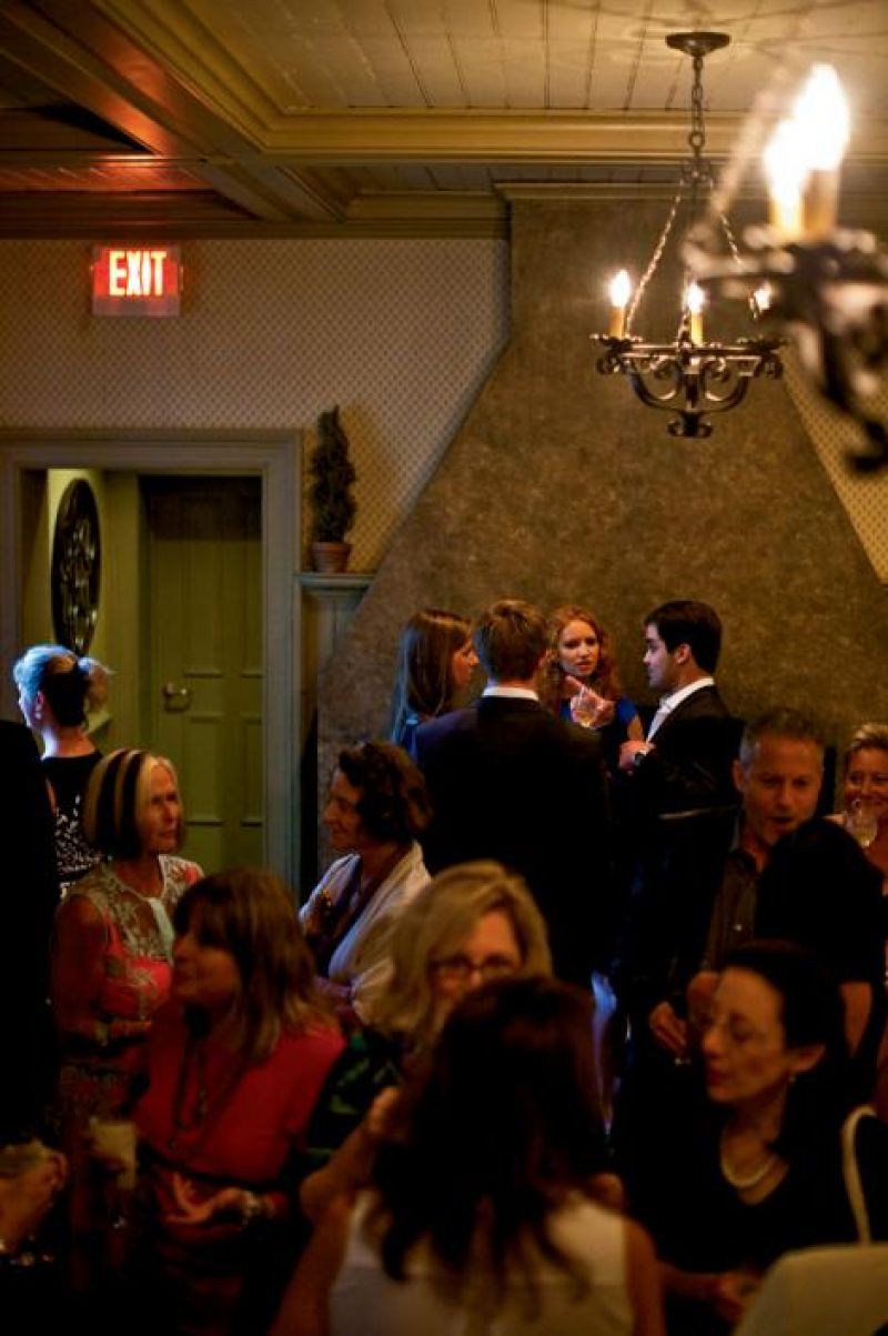 Guests enjoy pre-dinner cocktails at the Circa 1886 bar.