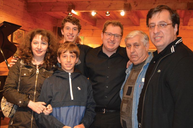 With his dad, Valentin, and brother, Dmitry, and his family after a performance at Grazhda, a Ukrainian cultural center in Hunter, New York.