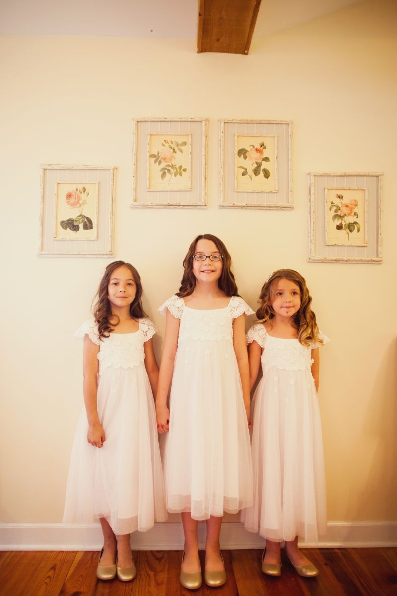 CUTIE PIES: Bridesmaids Elizabeth, Ella, and Gwyneth wore long, flowing Monique Lhuillier frocks from Nordstrom.