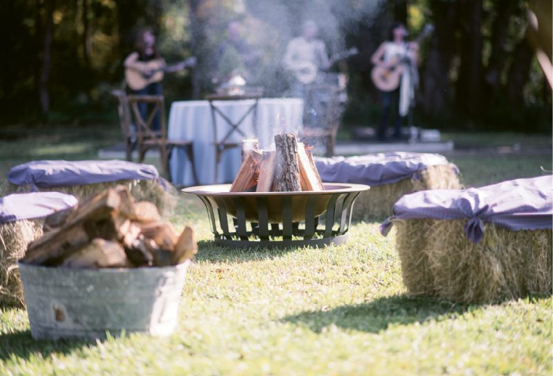 Down-Home Details: A “country cool” dress code ensured guests arrived ready to traipse about the rural venue. Hay bales picked up from a nearby supply store and barrels rented from Snyder Events added rustic charm aplenty.