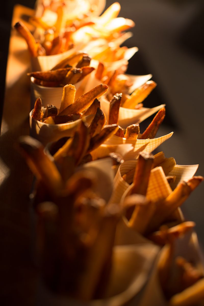 A fun bite inspired by The Village: hand cut “fry cones.”