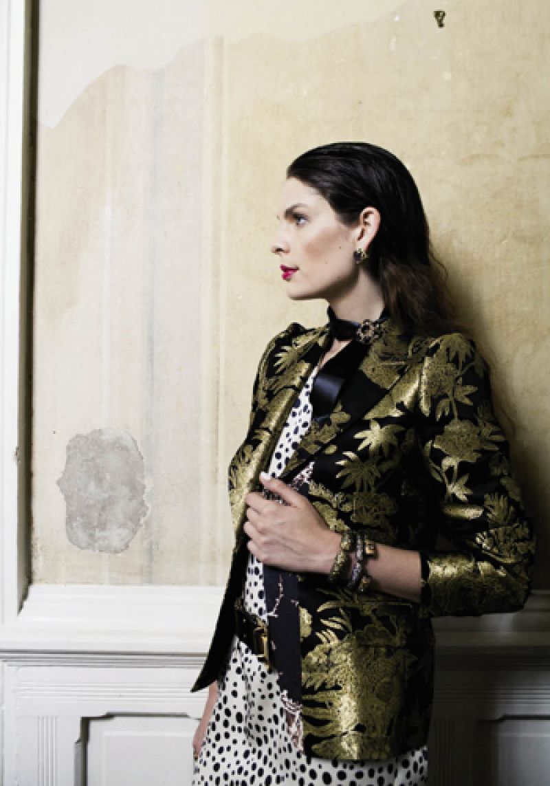 “Birdie” silk tunic by Tucker, $315 at Hampden Clothing; Dries Van Noten gold and black brocade jacket, price upon request at RTW; 14K gold earrings with grey mother-of-pearl, $1,870 at Croghan’s Jewel Box; ribbon, stylist’s own; vintage 14K gold and smoky quartz brooch, $1,500 at Joint Venture; Matthew Campbell Laurenza sterling bangles with yellow sapphire and small citrine, $2,050, yellow sapphire, $1,700, and orange sapphire and large citrine, $1,835, all at Paulo Geiss &amp; Sons; Suzi Roher