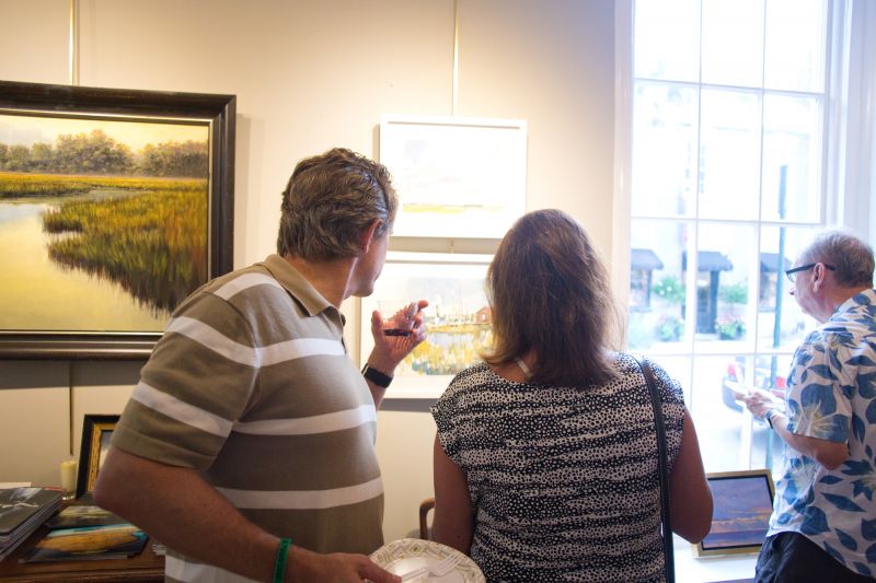 Guests admired works capturing scenes from the Lowcountry including marshes and shrimp boats.