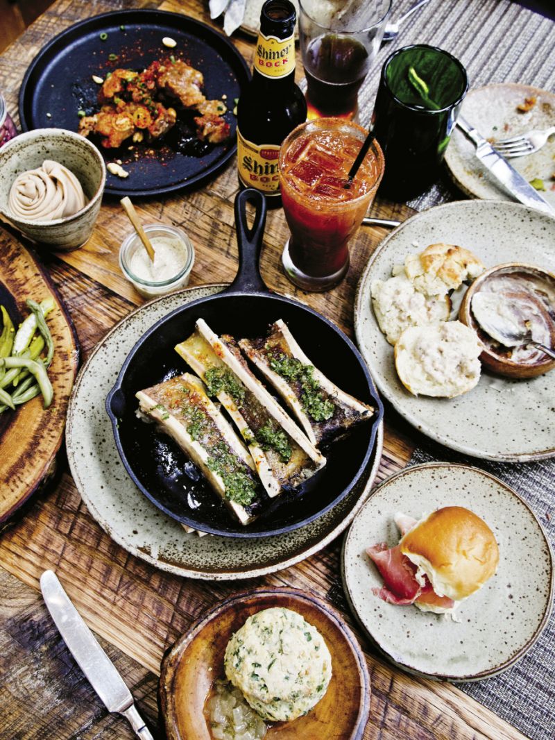 Brunch at Husk Nashville with a skillet of ember-roasted marrow, biscuits with sausage gravy, and spicy micheladas