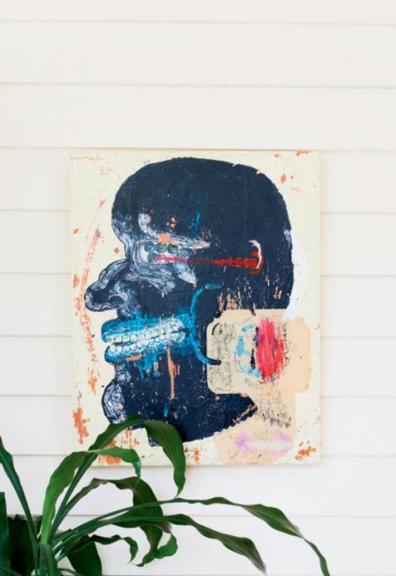 Tim Hussey’s Plastic Man hangs in the sunroom of Michelle Van Parys and Mark Sloan’s Hampton Park bungalow.