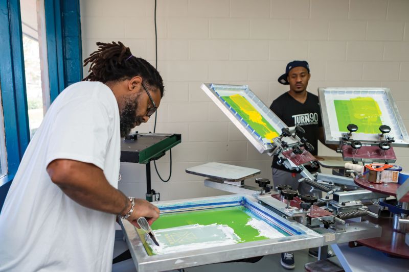 With hands-on training in screen printing, embroidery, and kit assembly, participants are paid an hourly wage while preparing them for success with future employment. When companies source products, such as T-shirts, from Turn90, they’re supporting both community and workforce development.