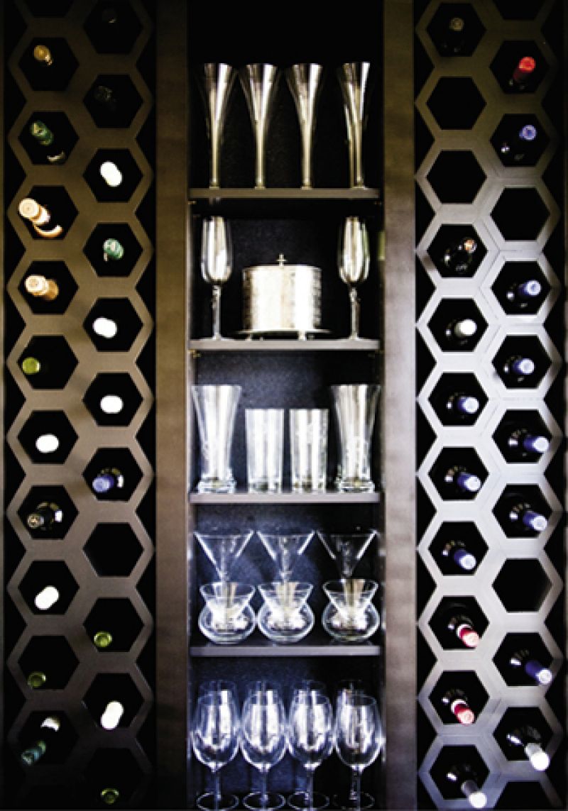 Keeping Cool: A wet bar off the kitchen features built-in hexagonal wine storage.