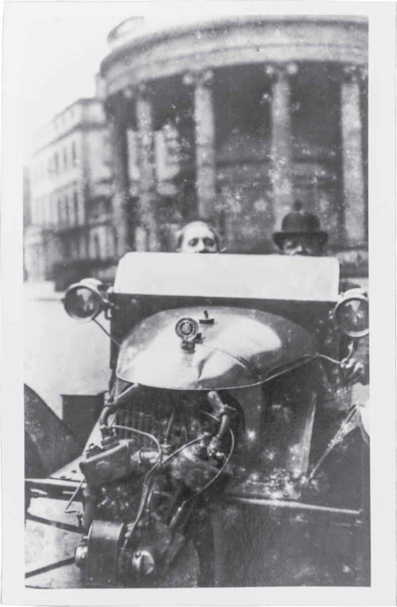 Edmund, driving with a friend (city and date unknown).