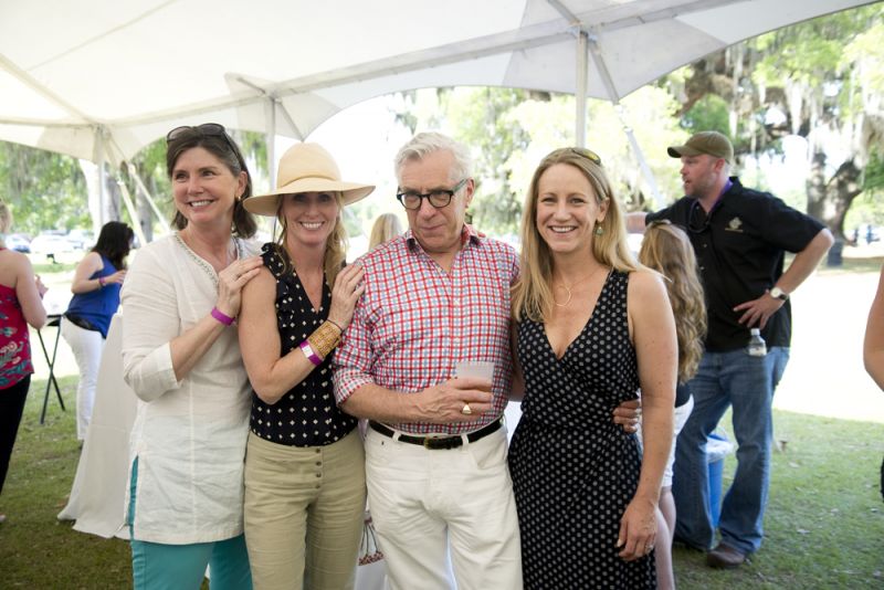 Theresa Evans, Leslie Turner, Terry Fox, and Charleston magazine editor-in-chief Darcy Shankland spend time outside before the live auction begins.