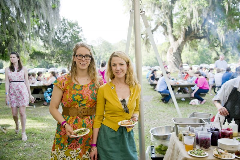 Sarah Jo Willis and Heather Keeler hang out under the tent while enjoying plates from Cypress.