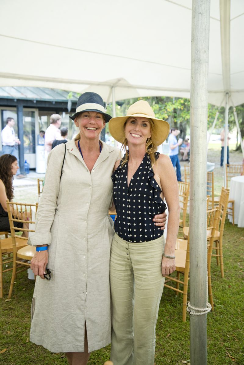 Stacie McCormick and Leslie Turner enjoy the sunny afternoon under the tent.