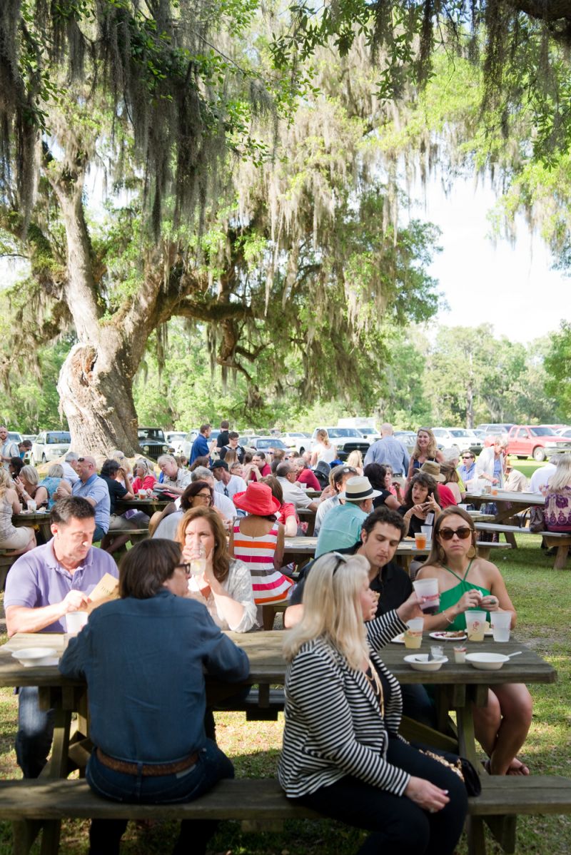 Guests enjoyed the warm weather while dining under sweeping oaks covered in Spanish moss.