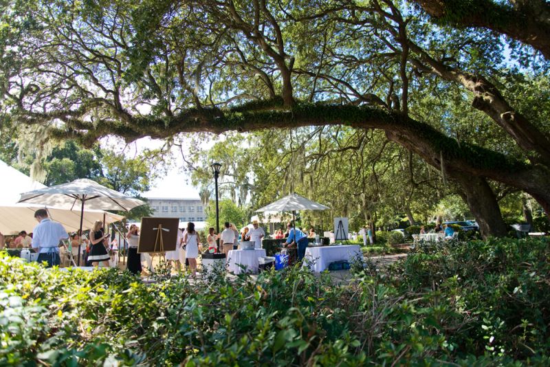 Live oaks surrounded the lawn where tables and tents were set.