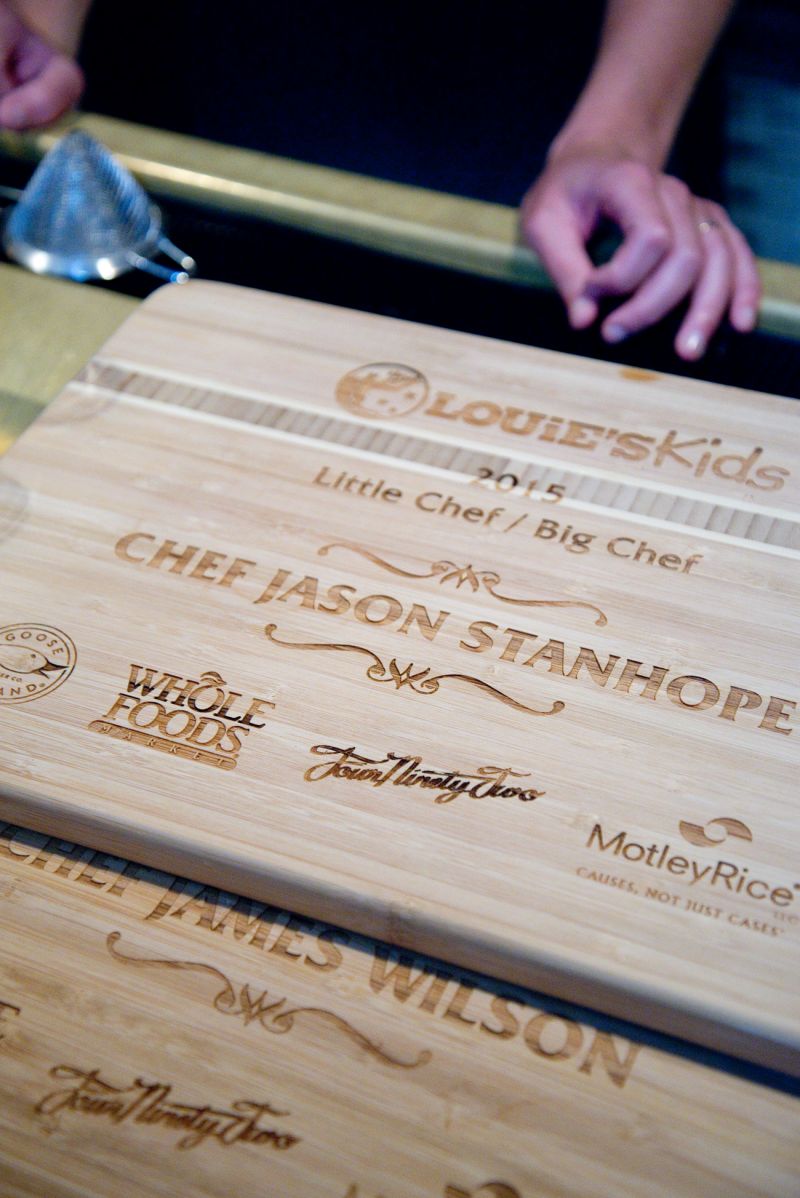 Cutting boards etched with the names of each little chef, big chef, and the event sponsors, were taken home by the little chefs as awards for their hard work.