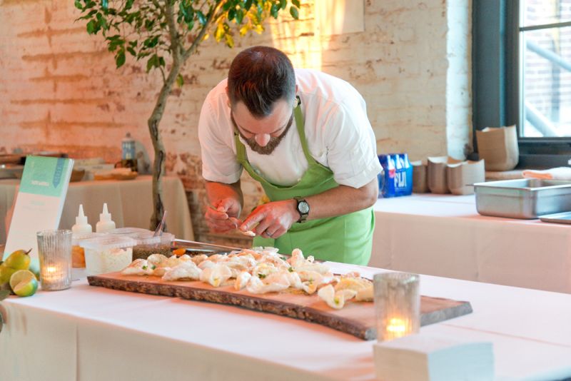 Josh Keeler of Two Boroughs Larder adds finishing touches to his evening appetizer.