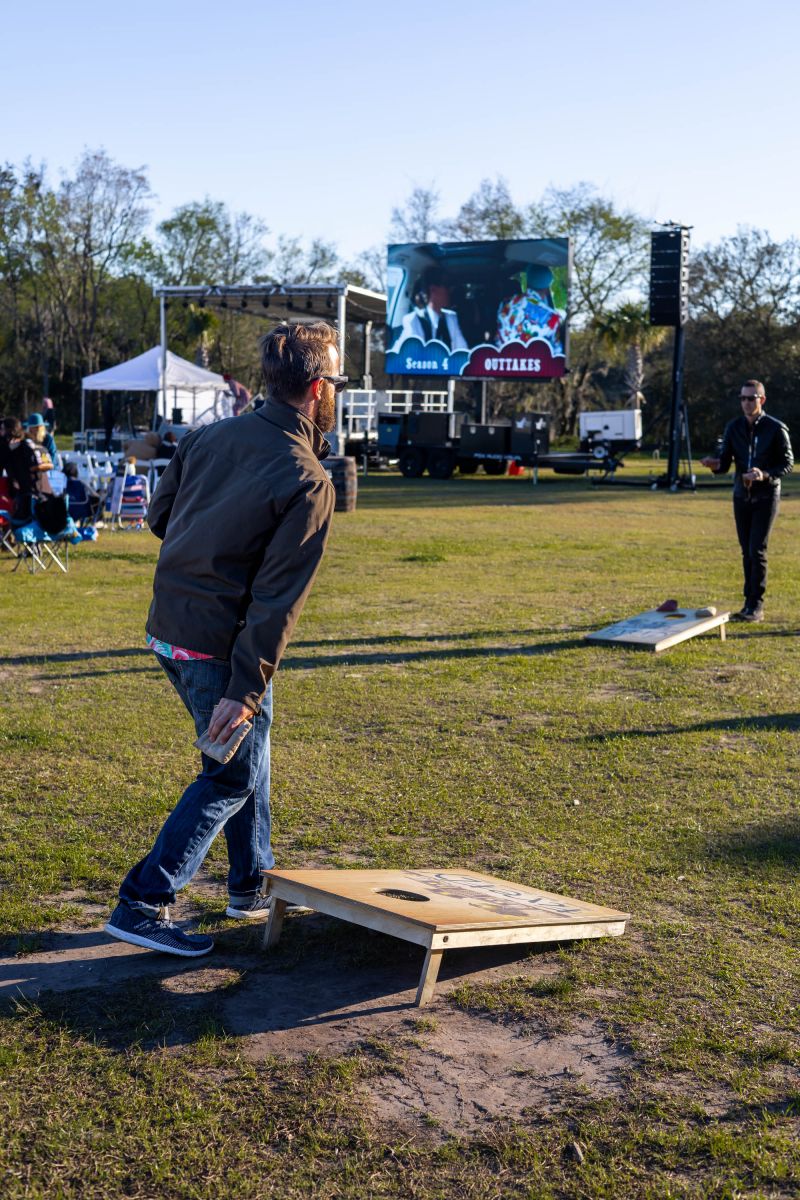 Guests played corn hole on the lawn of Firefly Distillery.
