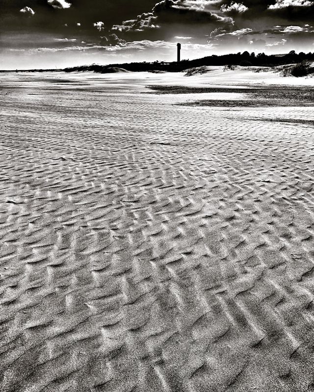 Tide and wind patterns in the sand.