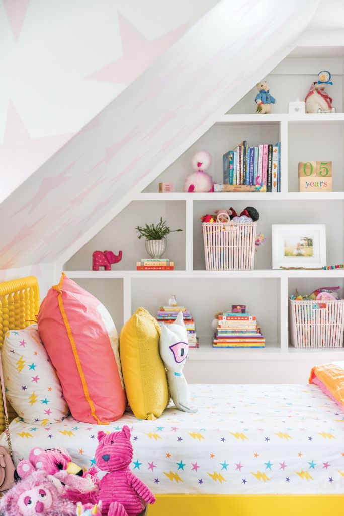 <strong>Star Power</strong> - Playful wallpaper, such as Sissy+Marley’s “Lucky Star,” helps make this a magical space for a five-year-old, as do built-ins rife with books and toys. <strong>Location:</strong> Downtown, South of Broad <strong>Issue:</strong> March 2019, “What’s Old Is New Again” <strong>Photographer:</strong> Katie Charlotte  <a href="https://charlestonmag.com/features/whats_old_is_new_again"><strong>&gt;&gt;CLICK HERE TO READ THE ARTICLE</strong></a>