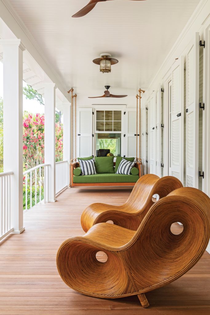 <strong>Swing Shift </strong>- A swing is a must for a Lowcountry porch. Designer Melissa Ervin covered this one in Sunbrella “Palm” canvas, adding the contemporary rattan Infinity loungers from Fritz Porter as a playful, artistic touch. <strong>Location:</strong> Sullivan’s Island <strong>Issue:</strong> June 2021, “Turn Back Time” <strong>Photographer:</strong> Julia Lynn <a href="https://charlestonmag.com/features/turn_back_time_a_rambling_1970s_beach_house_is_transformed_into_a_classic_coastal_cottage#"><strong> &gt;&gt;CLICK HERE TO READ THE ARTICLE</strong></a>