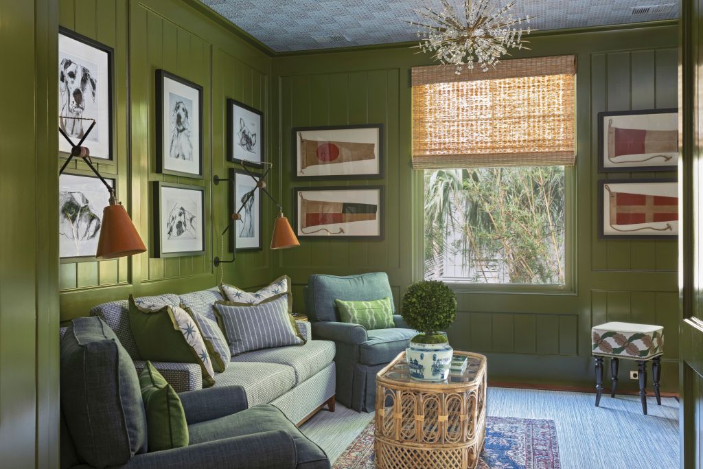 <strong>Green Scene</strong> - Lacquered in Farrow &amp; Ball’s bold green “Bancha,” this place is ideal for watching a movie or curling up with a good book. A mid-century Sputnik chandelier and whimsical dog prints by British artist Valerie Davide combine with a bamboo coffee table and leather sconces from Fritz Porter to add texture, depth, and interest to this comfortable, layered room. <strong>Location</strong>: Sullivan’s Island <strong>Issue:</strong> June 2021, “Turn Back Time” <strong>Photographer:</strong> Julia Lynn  <a href="https://charlestonmag.com/features/turn_back_time_a_rambling_1970s_beach_house_is_transformed_into_a_classic_coastal_cottage"><strong>&gt;&gt;CLICK HERE TO READ THE ARTICLE</strong></a>