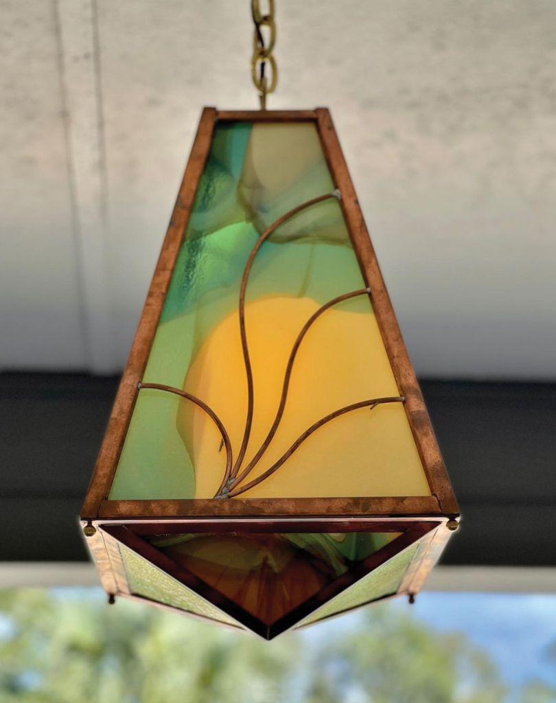 <i>The “Rooke” Arts and Crafts-style pendant fitted with handmade stained glass.</i>