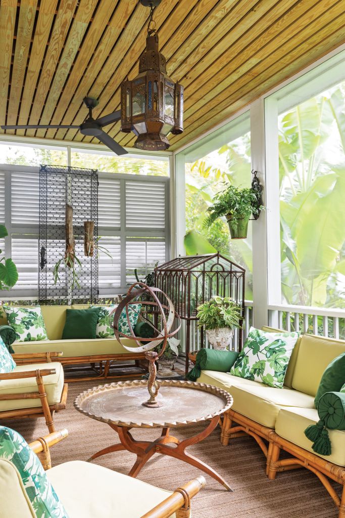 <strong>Tropical Vibes</strong> - Shaded by banana trees, this screened porch feels like an adult tree house. Designer Alexandra Howard used grass matting, bamboo furniture, and her parents’ collectibles to give it the breeziness of a South Asian veranda. <strong>Location:</strong> Downtown, Harleston Village <strong>Issue:</strong> September 2022,  “East Meets West”<strong> Photographer:</strong> Julia Lynn  <a href="https://charlestonmag.com/features/east_meets_west_designer_alexandra_howard_blends_asian_antiques_with_classic_charleston#"><strong>&gt;&gt;CLICK HERE TO READ THE ARTICLE</strong></a>