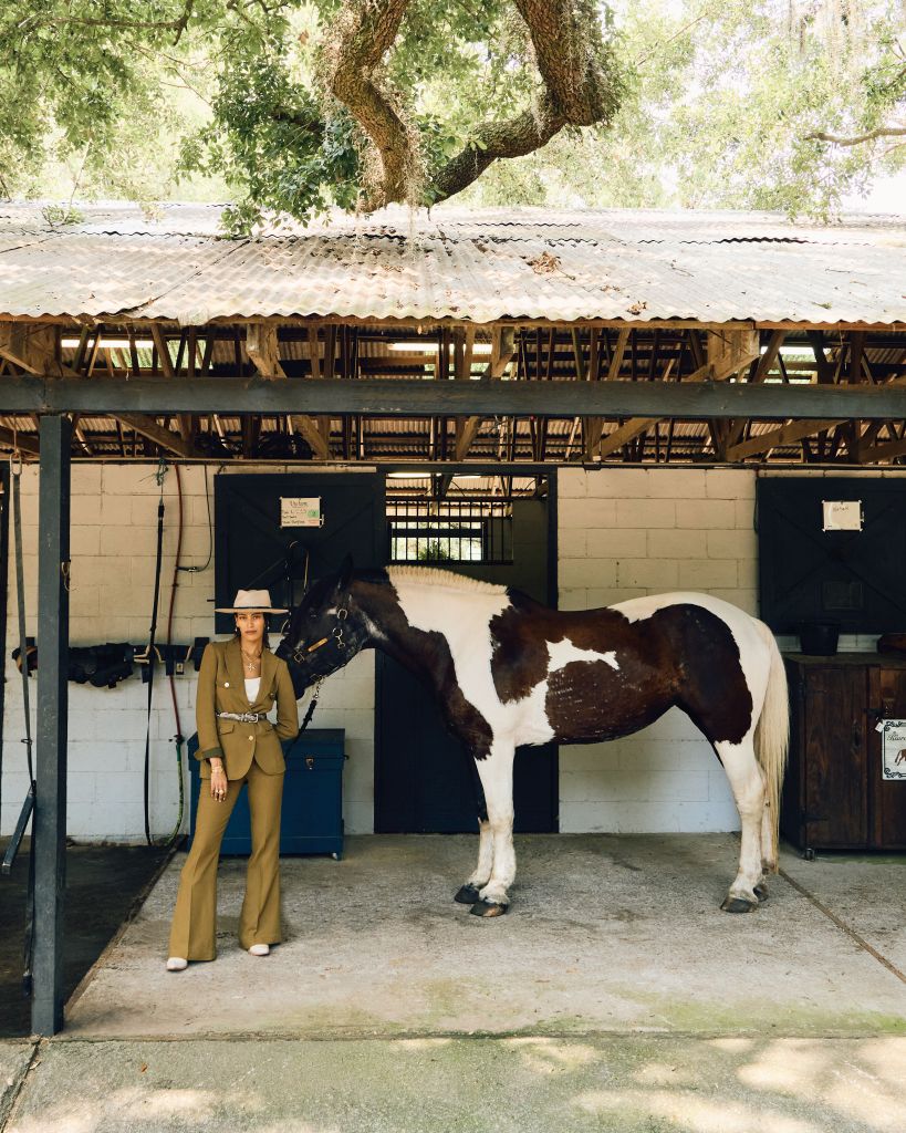 <b>Standing Tall:</b> St. John textured crepe jacket, $1,995, and pant, $995, both at St. John; Peserico satin bandeau top, $345, at Peserico; Southern Ruetz “Refined Rebel” hat, $755 at Southern Ruetz; Gavazzeni python belt, $450 at Gwynn’s of Mount Pleasant; Freebird “Woodland” boots, $275 at Freebird; Freida Rothman “Blossoming Brilliance” hoop earrings, $295, Elizabeth Locke “Orvieto” necklace, $11,000, “Maltese Cross” pendant, $5,700, “Queen Bee” diamond ring, $6,700; Victorian 18K-gold bangle, $3,450, and Goldbug “Palmetto” cuff, $135, all at Croghan’s Jewel Box; AL&amp;EM bezel diamond solitaire, $4,250 at <a href="https://xoalem.com/">xoalem.com</a>