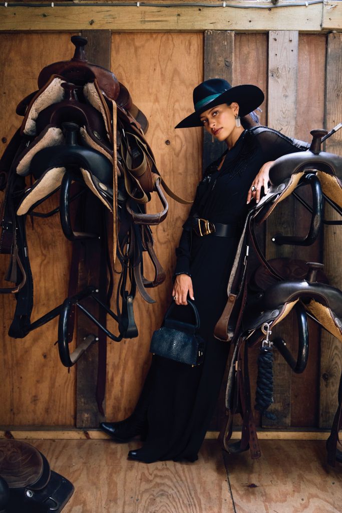 <b>Rein Supreme:</b> St. John silk georgette gown, $1,995 at St. John; Marsh &amp; Magnolia “Standard” hat, $175 at Marsh &amp; Magnolia; Brandon Maxwell leather belt with gold knot buckle, $795 at Gwynn’s of Mount Pleasant; leather cowboy boots, $400, and earrings, $95, at 7 Hills Living; estate pearl, diamond, and onyx ring, $1,500, and estate diamond and onyx ring, $2,500, both at Gold Creations; Boysterous doctor’s bag in stingray and crocodile leather, $2,000 at Boysterous.