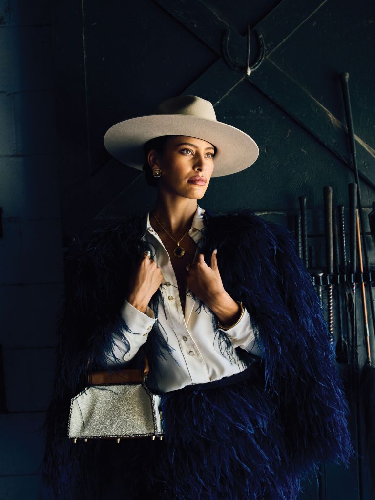 <b>In Full Feather:</b> Dorothee Schumacher “Feathery Volume” jacket, $1,280, and skirt, $690, both at Showroom Kiawah; St. John silk crepe de chine blouse, $358 at St. John; Marsh &amp; Magnolia “Standard” hat, $175 at Marsh &amp; Magnolia; Capucine De Wulf “Blandine” clip earrings, $125, and “Cleopatra” hinged bangle, $145, both at Rhodes Boutique; Elizabeth Locke smoky quartz and cognac diamond pendant, $5,600, and Temple St. Clair chain necklace, $1,700, both at Croghan’s Jewel Box; estate gray pearl and diamond ring, $2,250, and estate Mabe pearl ring, $1,750, both at Gold Creations; Boysterous doctor’s bag in stingray leather, $1,600 at Boysterous.