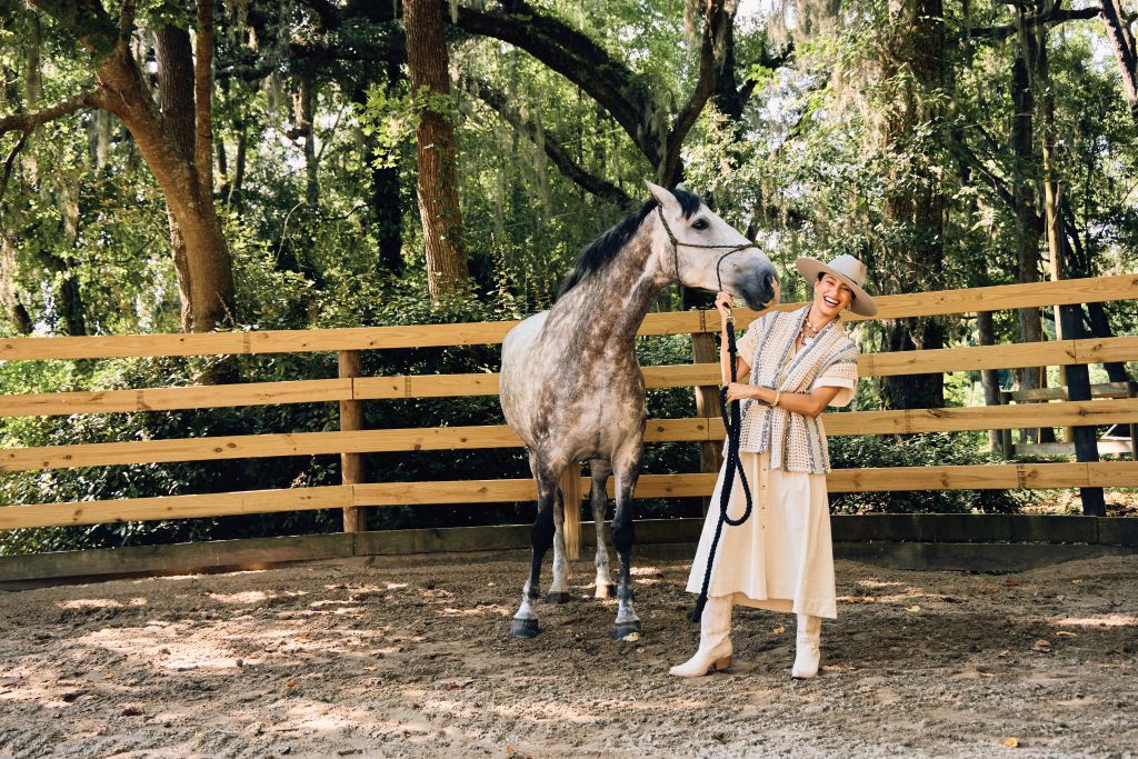 <b>Leading the Way:</b> Just Bee Queen “Freya” midi shirtdress, $545 at Beckett Boutique; Brunello Cucinelli striped knit cardigan, $6,500 at RTW; Marsh &amp; Magnolia “Standard” hat, $175 at Marsh &amp; Magnolia; W. Kleinberg crocodile belt, $600 at RTW; Freebird “Woodland” leather boots, $275 at Freebird; Temple St. Clair “Galaxy” moonstone and diamond drop earrings, $9,500, Freida Rothman “Signature Chunky Link” necklace, $595, and “Brooklyn In Bloom” pendant, $350, all at Croghan’s Jewel Box; Girl with a Pearl “Bohemian Knotty” necklace, $495 at Well Furnished; Capucine De Wulf “L’Amour Toujour” hinged bangle, $195 at Rhodes Boutique; Goldbug Collection “Pearl Palm Frond” bangle, $145 at Croghan’s Jewel Box.