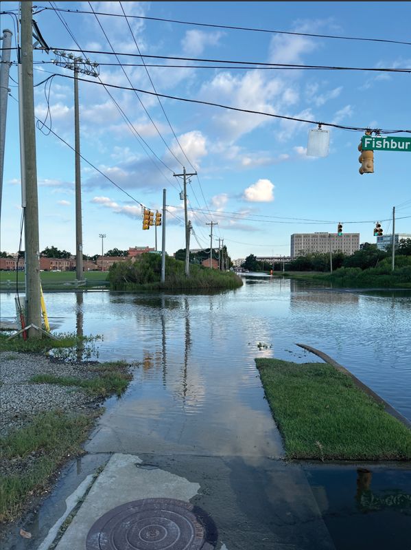 A post of king tide flooding at Hagood Avenue and Fishburne Street.