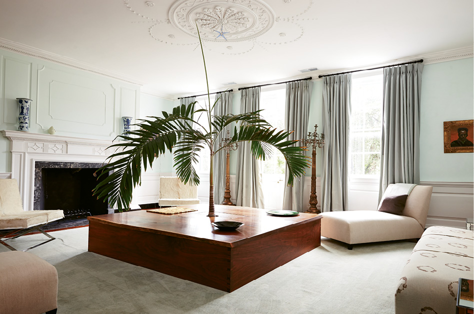 ELEMENT OF SURPRISE: De Givenchy designed this seven-by-seven-foot square table, crafted by Savannah-based furniture maker Greg Guenther from 100-year-old walnut, around an unexpected centerpiece: a live palm tree.